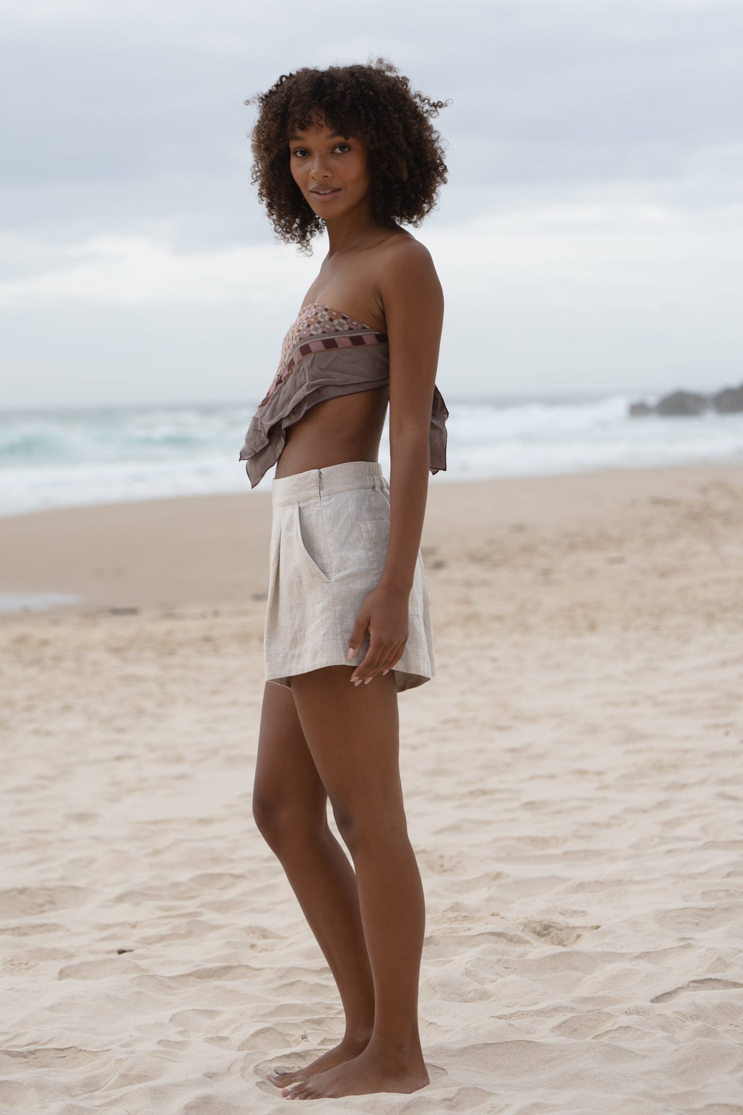 LILLY PILLY Gaia linen shorts in Oatmeal side view showing hidden zipper