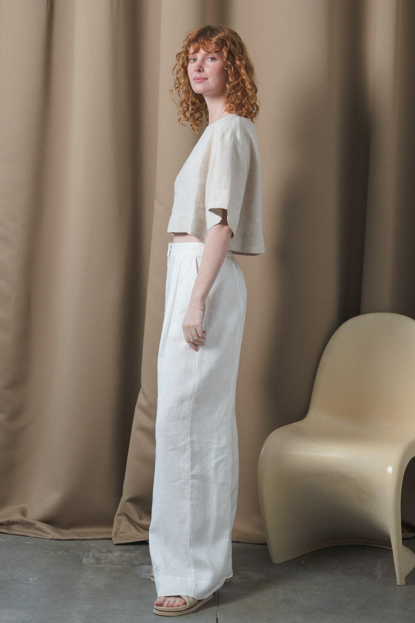 LILLY PILLY Oli linen pants in Ivory side view in studio