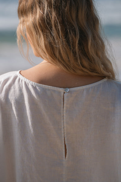 Lilly Pilly Collection Tina top made from 100% Organic linen in Ivory, showing close up of back button detail
