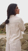 Model wearing a LILLY PILLY Quinn linen shirt top paired with Rika linen pants in Chalk
