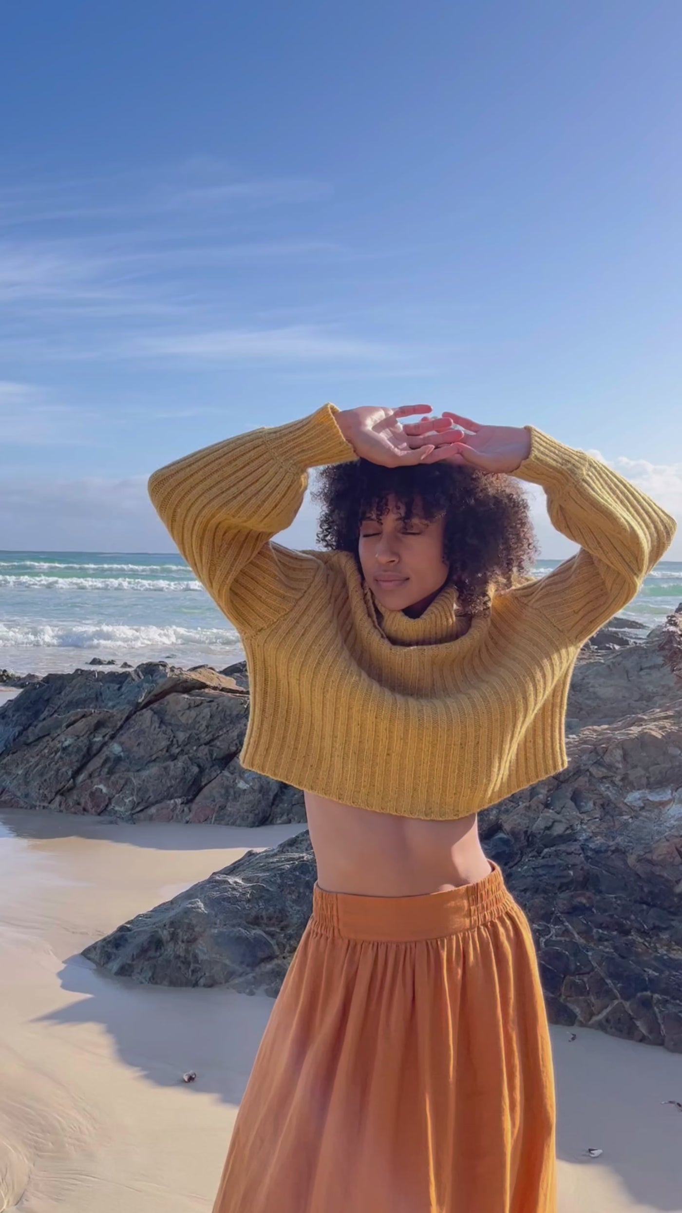Video of LILLY PILLY Collection Arya merino wool Knitwear top in Sunflower speckle paired with Frida organic linen skirt in Cinnamon