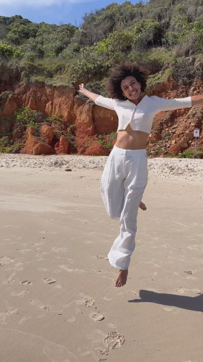 Video of Lilly Pilly Collection recycled Cashmere cardigan top in Ivory paired with Olivia organic linen pants in Ivory