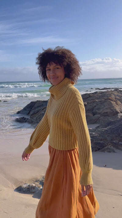 Video of Lilly Pilly Collection Hannah skirt made from 100% Organic linen in Cinnamon paired with Arya merino wool knitwear in Sunflower Speckle